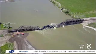 Cleanup of train derailment and bridge collapse continues