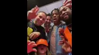 Meek Mill, Michael Rubin, and Lil baby fooling around at the Super Bowl