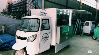 The white electric tuk ape food truck