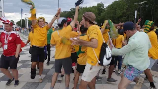 Fans from Denmark and Australia are having fun together and dancing at the Samara arena stadium.