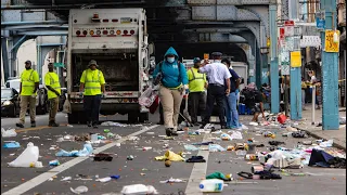 Philadelphia city workers clear out homeless encampments on Kensington Avenue