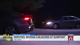 Woman carjacked at gun point