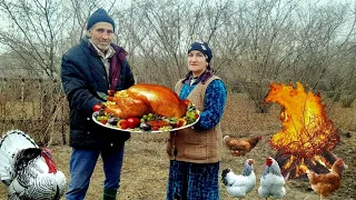 We bury a large turkey with rice and spices in coals and simmer