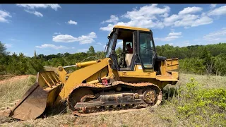 Clearing with a Cat 953C track loader