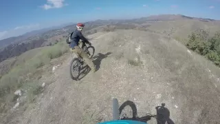 2014 Santa Cruz V10 with a 1000w Motor in Chasing an Identical Bike powered OFF Hucking Big! (C-34)