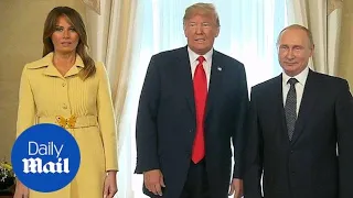 Melania Trump pulls face after shaking Vladimir Putin's hand
