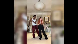 Madonna dances to "La rebelion" by Joe Arroyo with her son