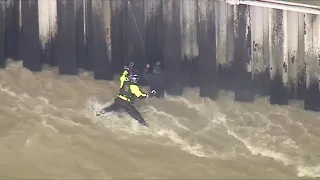 Crews rescue man from rain-swollen Los Angeles River