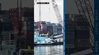 Crews continue clearing containers from "The Dali" at the site of the Key Bridge collapse