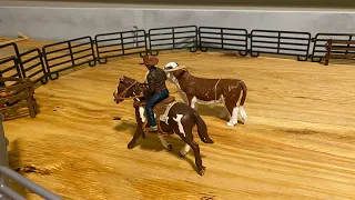 Kids Toy Rodeo roping a rank bull in the arena