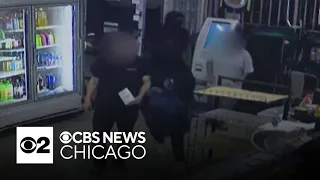 Surveillance video shows armed robbers targeting Chicago liquor stores