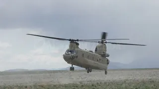 Stock Video - chinook helicopter landing in field durning training