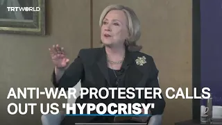 Hillary Clinton confronted by anti-war activist