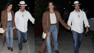 Nikki Reed and Ian Somerhalder lovingly hold hands during romantic dinner date