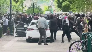 Car drives through crowd as PSU protesters move through downtown Portland