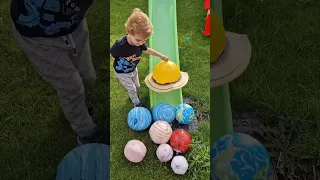 Justin plays with his inflatable planets! Learn about the solar system.