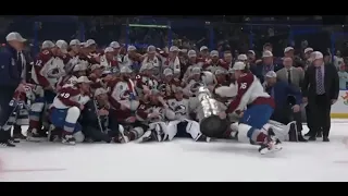 Nicolas Aube-Kubel falls with Stanley Cup