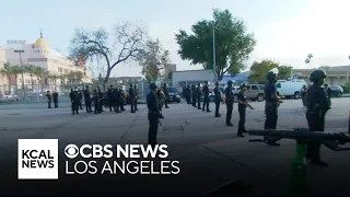 Police form skirmish line outside of Pomona College graduation after scuffle with protesters