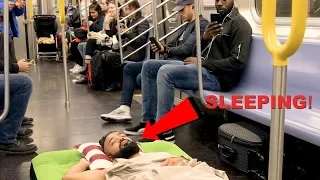 Man Takes A Nap On Air Bed (NYC Subway)