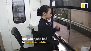 Toll booth worker in China forced to smile despite scolded by a driver!