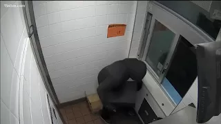 Employee escapes armed robber who climbs through drive-thru