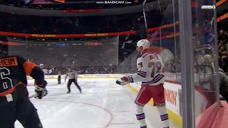 K'Andre Miller, tripped, gets up and finishes a breakaway.