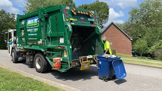 Garbage Truck collecting heavy garbage