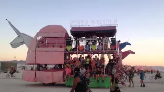 Watching Charlie the Unicorn Art Car go by at Burning Man 2014