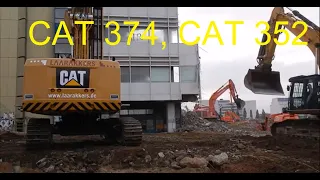 Excavator CAT 352 F and 374 F prepare demolition site