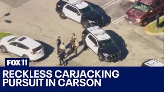 Armed carjacking suspect arrested after pursuit