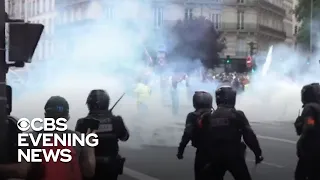 Protesters march in Paris to oppose possible "virus pass" mandate