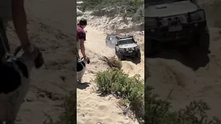 gu patrol 4.8 tb48 dragging hilux up dune.