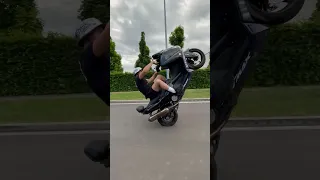 Guy Fails Doing a Wheelie on a Tmax Scooter