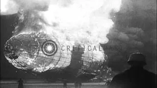 LZ-129 Hindenburg airship engulfed in flames crashes into ground at Lakehurst Nav...HD Stock Footage