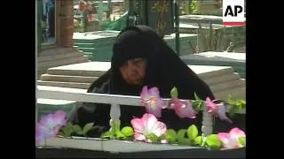 Relatives of some of those killed since the fall of Saddam gather at graveside