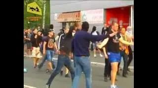 Kharkov, Ukraine, 27.4.2014: Neonazis mob beating up bicyclist and destroying car