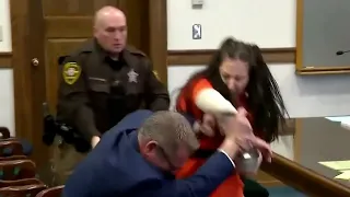 Murder suspect attacks her lawyer in court