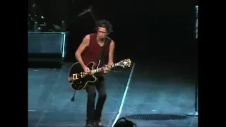 Keith Richards starts playing It's Only Rock 'n Roll, while Mick Jagger starts singing Satisfaction