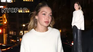 Gigi Hadid arrives to her Guest In Residence store opening flanked by security in NYC