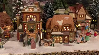 Dept 56 Tim Coughlan Dickens village with snow.