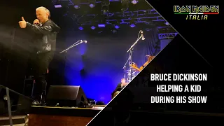 Bruce Dickinson helping a young fan during his show (2024)