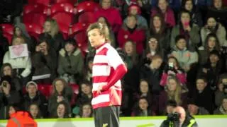One Direction's Louis Tomlinson makes his football debut for Doncaster Rovers