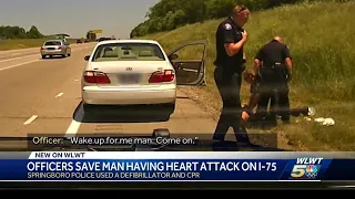 Officers save man having heart attack on I-75