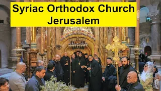 During Holy Week, the Assyrian Church procession enters the Church of the Resurrection in Jerusalem