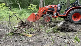 Pulling stumps and breaking chains with compact tractor