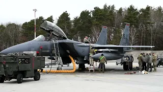 U.S. Air Force Airmen  maintening F-15 Strike Eagles during NATO's enhanced Air Policing