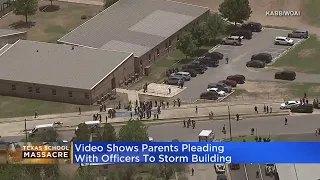 Video from Texas school massacre shows parents begging police to storm building