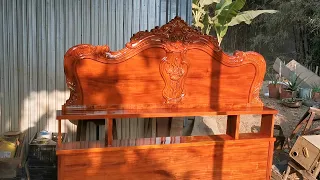 The process of making a wooden bed with western flowers and leaves by an Asian carpenter