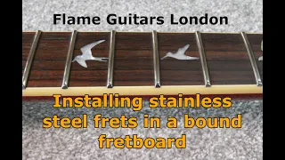 Installing stainless steel frets in a bound fretboard