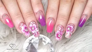 Pink and purple ombre nails with one stroke flowers.